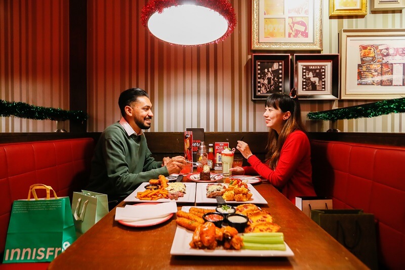 Customers enjoying Christmas sets at TGIF, at Sunway Pyramid